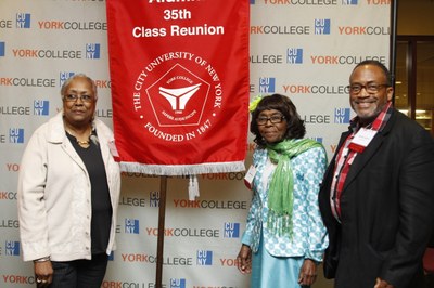 Alums with 35th class reunion banner