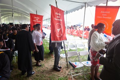 Alums being seated in tent for Commencement Exercises